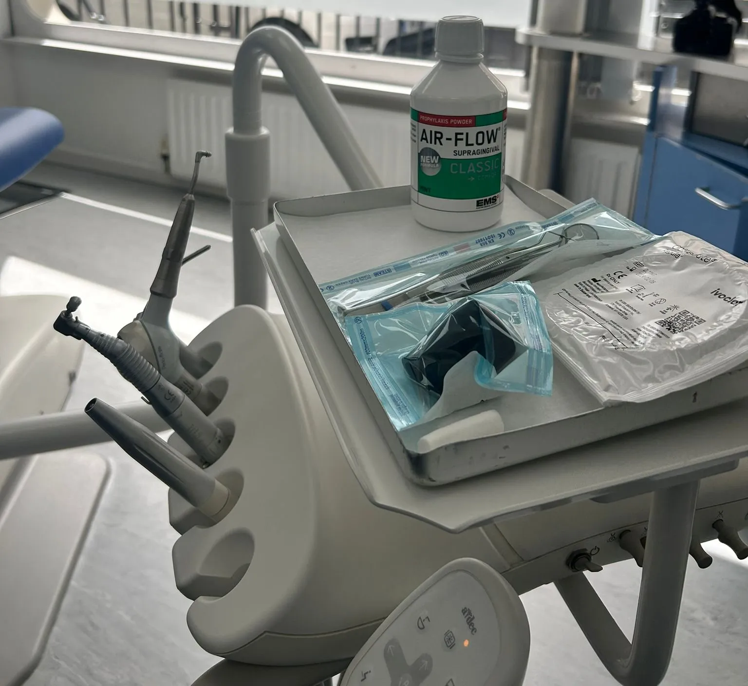 Instrument tray and handpieces in a treatment room at Paddington Smiles